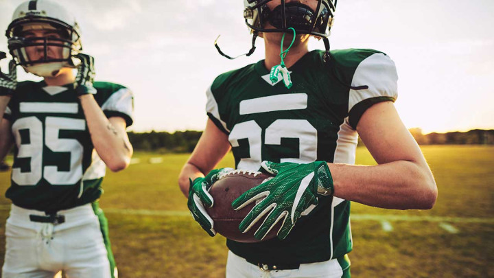 football players in green and white jerseys