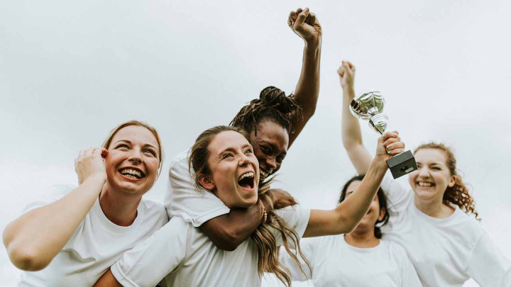 womens sports team celebrating